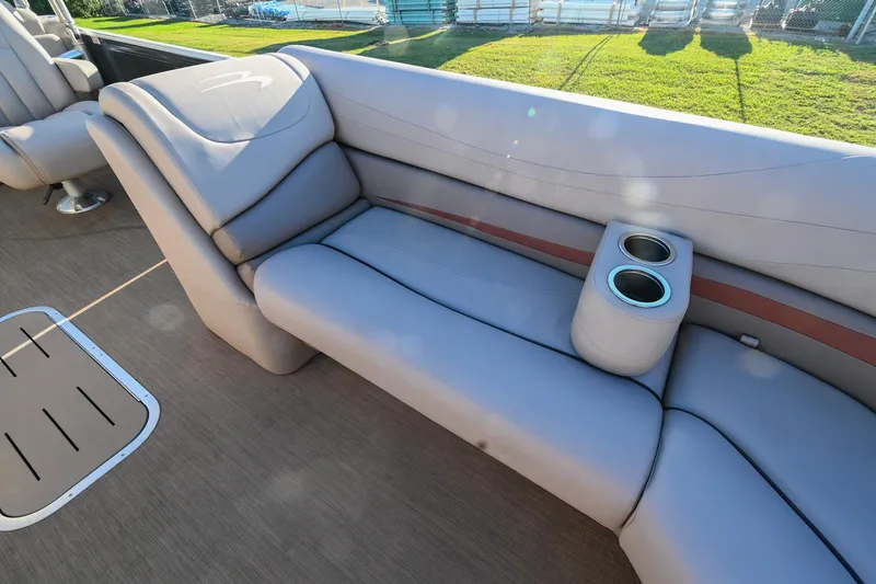 Slide: The Image of 2017 Bennington 23 GCW boat interior with plush seating and cup holders. - 14