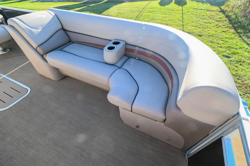 Slide: The Image of 2017 Bennington 23 GCW boat interior with plush seating and cup holders. - 15