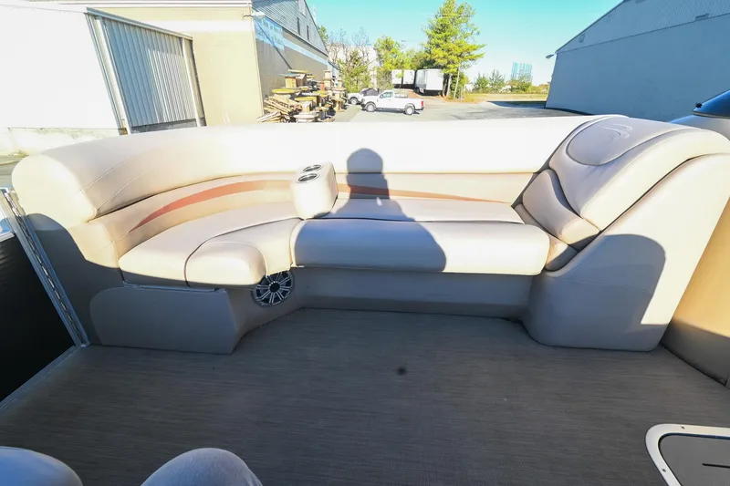 Slide: The Image of 2017 Bennington 23 GCW boat interior with beige seating and cup holder. - 19