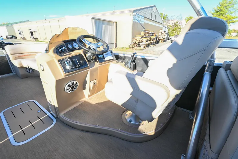 Slide: The Image of 2017 Bennington 23 GCW boat interior with steering console and seating. - 26
