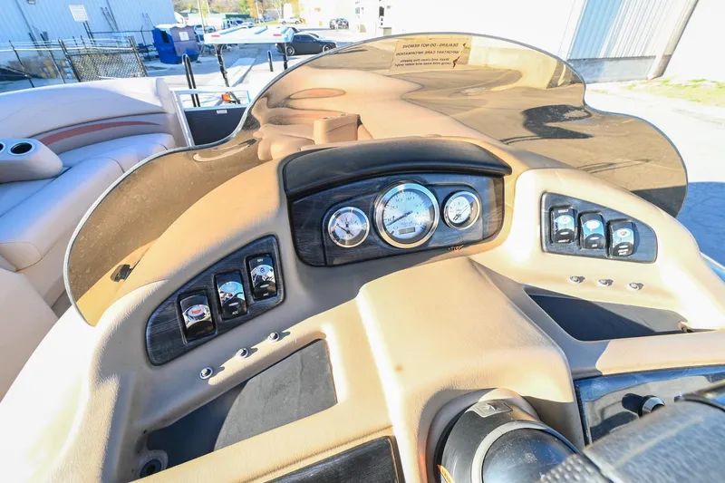 Slide: The Image of Dashboard of a 2017 Bennington 23 GCW boat with gauges and controls. - 29