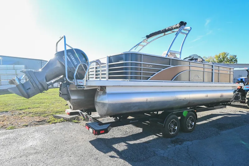 Slide: The Image of 2017 Bennington 23 GCW pontoon boat with Yamaha outboard motor on trailer. - 3