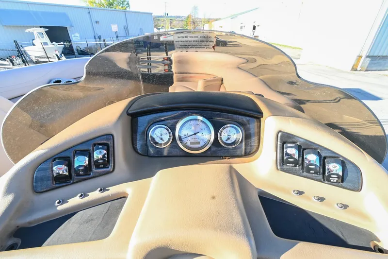 Slide: The Image of 2017 Bennington 23 GCW boat dashboard with gauges and controls. - 30