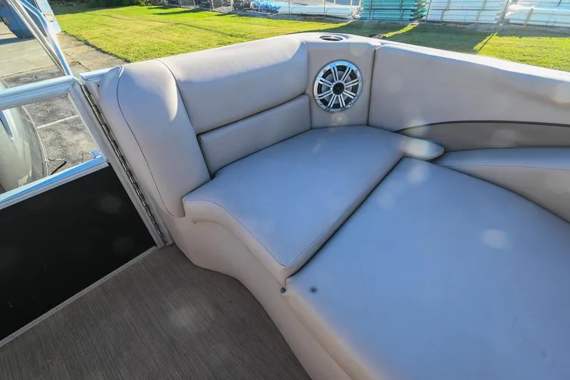 Slide: The Image of 2017 Bennington 23 GCW boat interior with cushioned seating and speaker. - 34