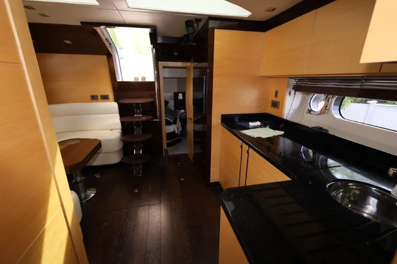Slide: The Image of Interior of 2014 Sunseeker San Remo yacht with modern kitchen and dining area. - 16