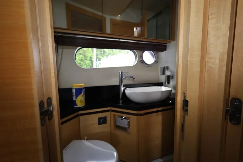 Slide: The Image of Luxurious 2014 Sunseeker San Remo yacht bathroom with modern fixtures and wood accents. - 17