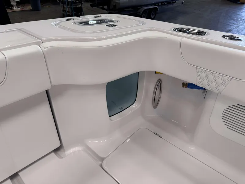 Slide: The Image of 2025 Phenom 37 CC boat interior, featuring sleek white design and modern amenities. - 12