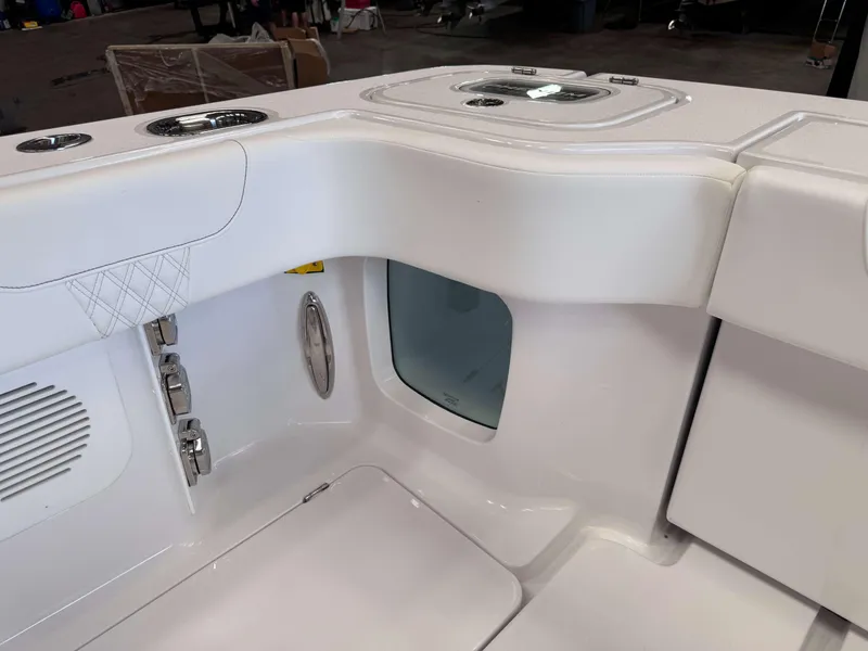 Slide: The Image of Phenom 37 CC 2025 boat interior, featuring sleek white seating and modern design elements. - 13