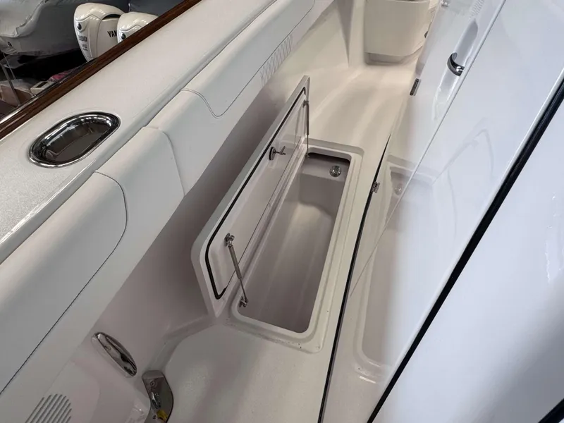 Slide: The Image of 2025 Phenom 37 CC boat interior with open storage compartment. - 20