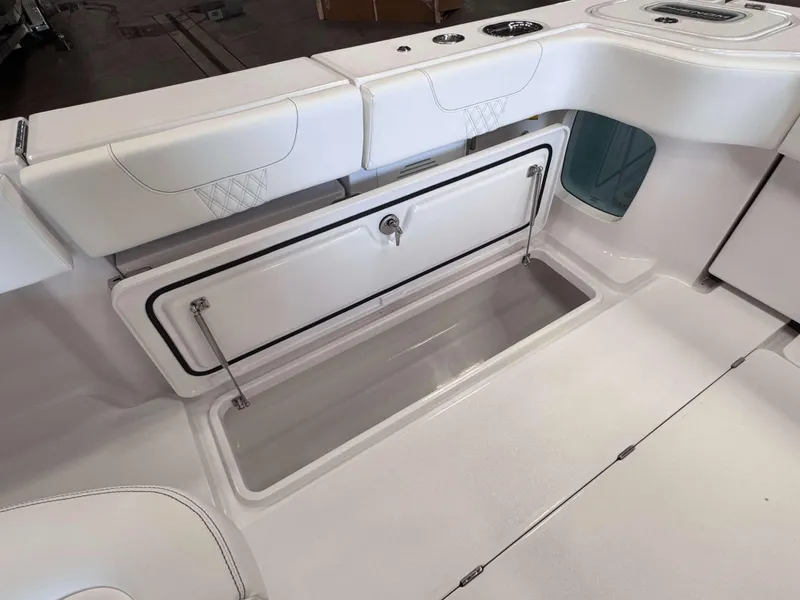 Slide: The Image of 2025 Phenom 37 CC boat interior with open storage compartment. - 23