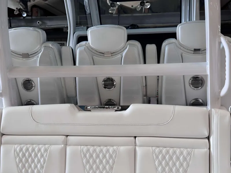 Slide: The Image of Luxurious white leather seats in 2025 Phenom 37 CC boat interior. - 26