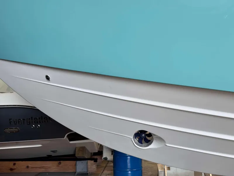 Slide: The Image of Close-up of 2025 Phenom 37 CC boat hull in light blue and white. - 3