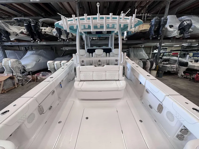 Slide: The Image of 2025 Phenom 37 CC boat interior in storage, showcasing spacious seating and modern design. - 8