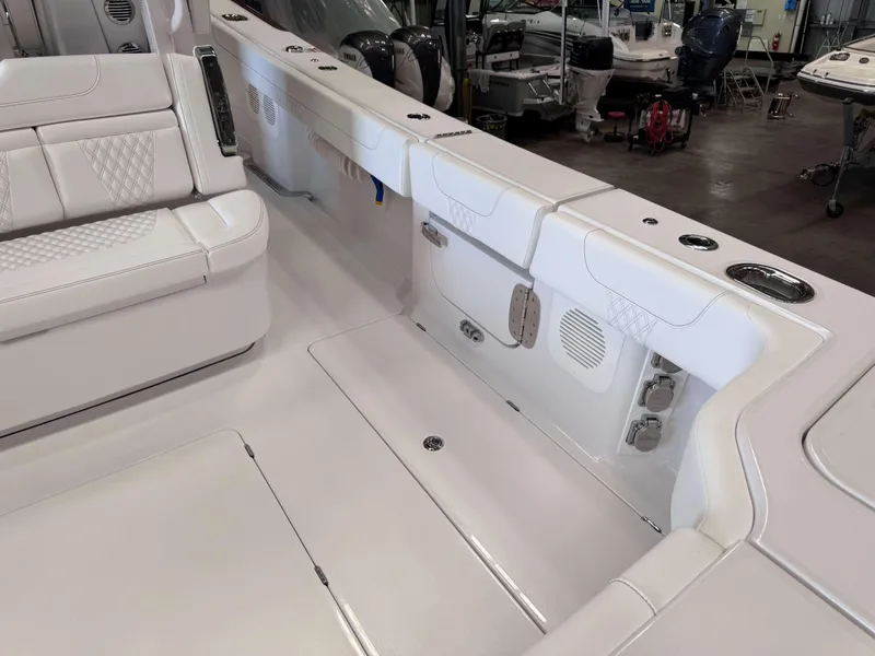 Slide: The Image of Interior of 2025 Phenom 37 CC boat, featuring white seating and modern design. - 9