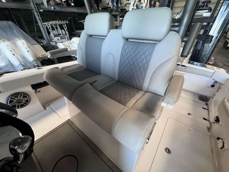 Slide: The Image of Luxurious seating on 2025 Solace 32 CS boat, featuring modern design and comfort. - 13