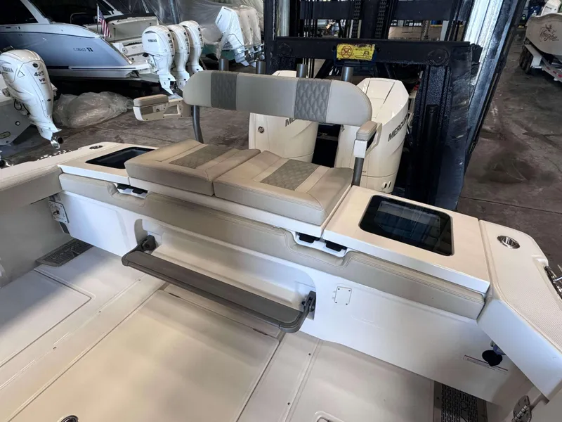 Slide: The Image of 2025 Solace 32 CS boat interior with seating and storage compartments. - 20