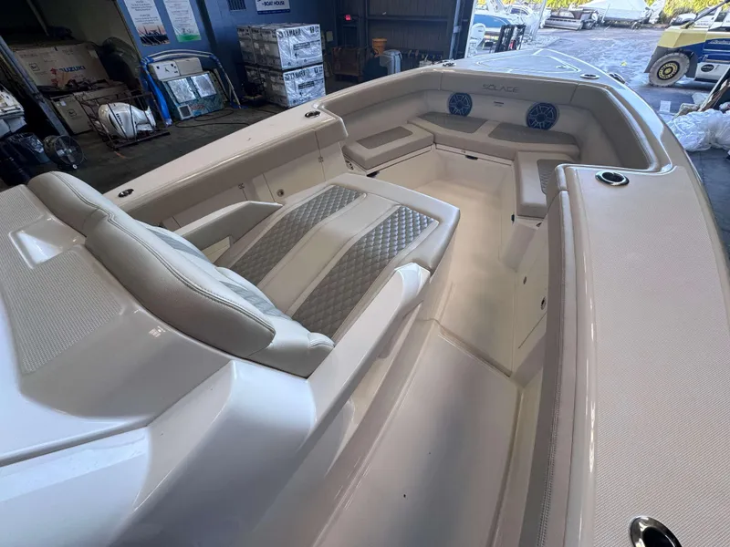 Slide: The Image of 2025 Solace 32 CS boat interior with luxurious seating and modern design. - 5