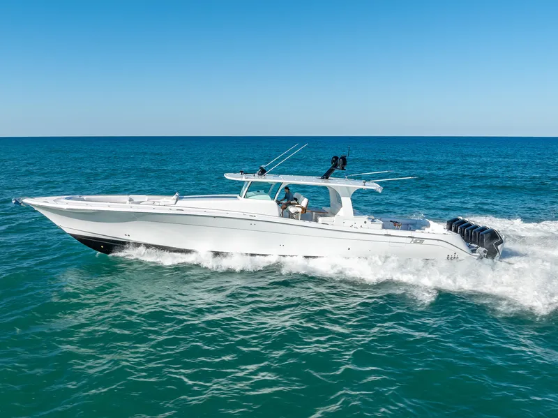 Slide: The Image of 2025 HCB 65 Estrella cruising on open ocean under clear blue sky. - 1
