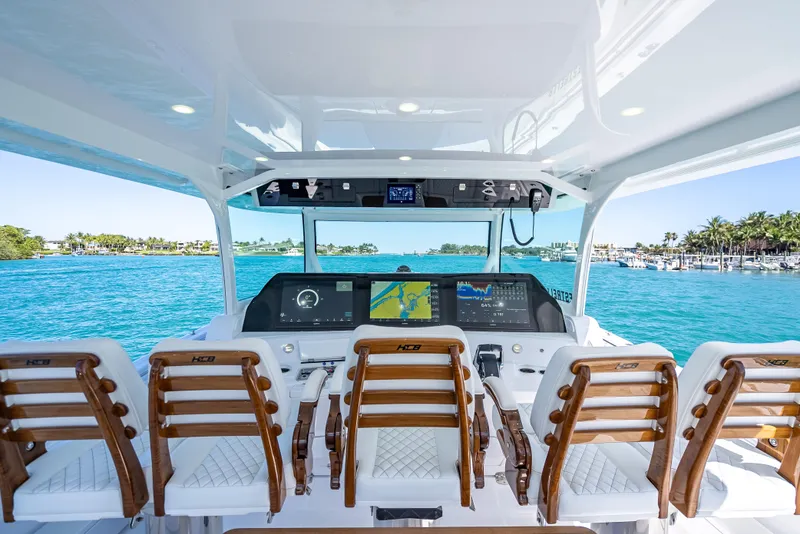 Slide: The Image of 2025 HCB 65 Estrella yacht helm with advanced navigation system and luxurious seating. - 10