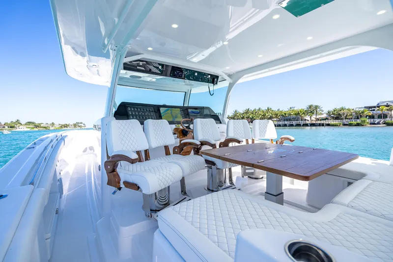 Slide: The Image of Luxurious 2025 HCB 65 Estrella yacht interior with elegant seating and ocean view. - 13
