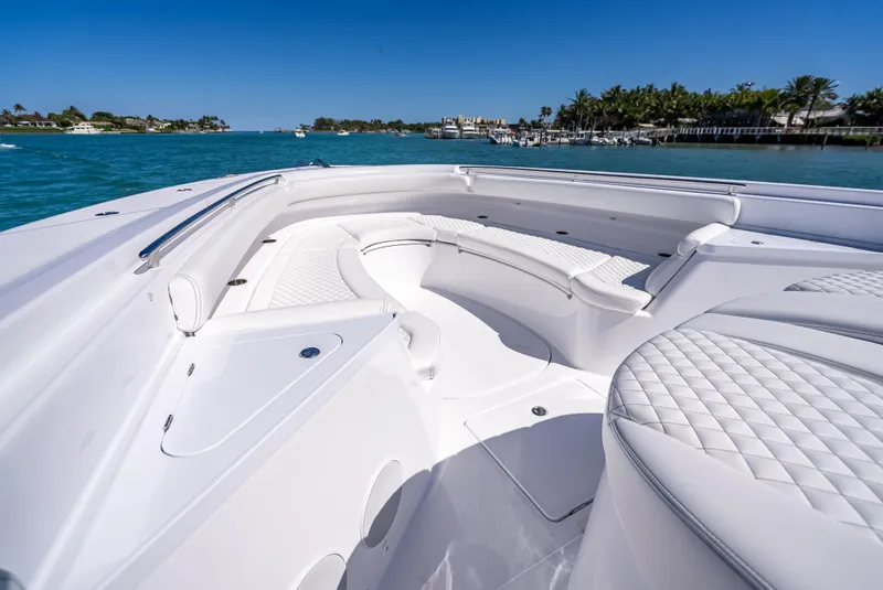 Slide: The Image of Luxurious 2025 HCB 65 Estrella boat interior with white seating on a sunny day. - 19
