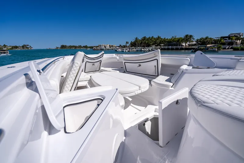 Slide: The Image of Luxurious 2025 HCB 65 Estrella yacht interior with white seating and ocean view. - 20