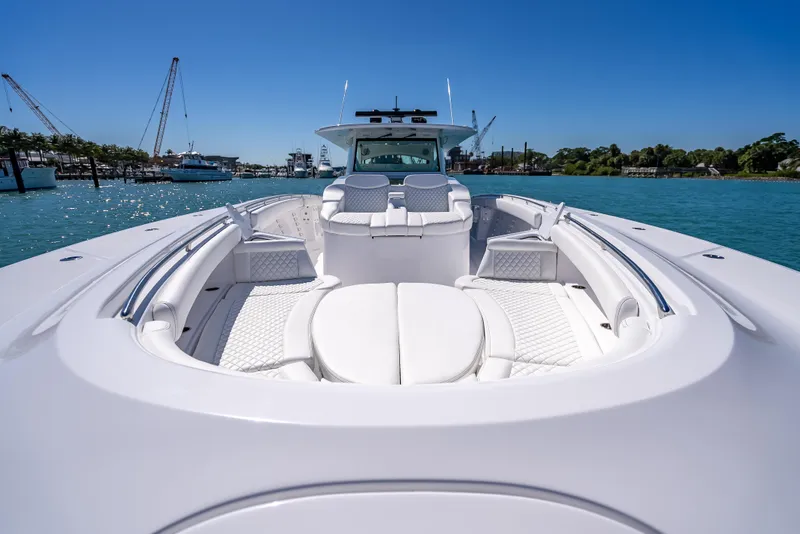 Slide: The Image of 2025 HCB 65 Estrella luxury boat on clear blue water. - 21