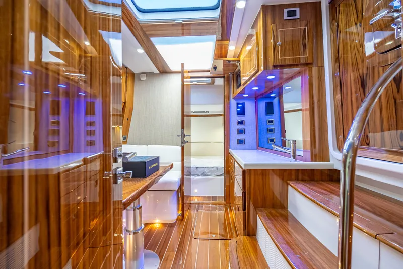 Slide: The Image of Luxurious interior of 2025 HCB 65 Estrella yacht with polished wood and modern amenities. - 22