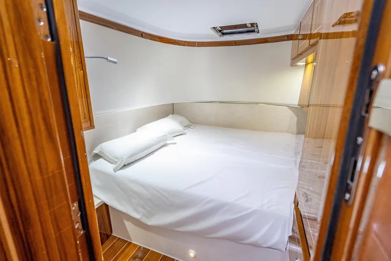 Slide: The Image of Luxurious cabin interior of 2025 HCB 65 Estrella yacht with cozy bed. - 26