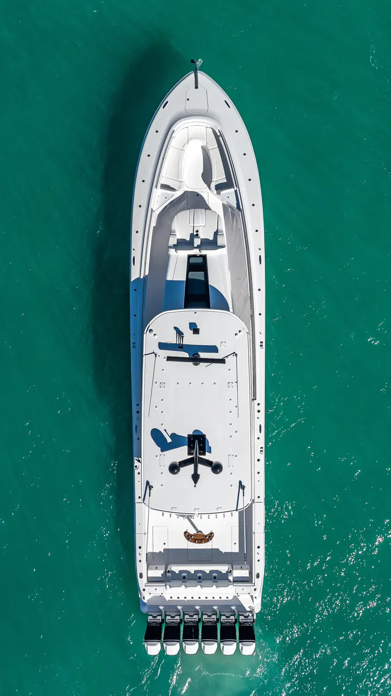 Slide: The Image of Aerial view of 2025 HCB 65 Estrella yacht on turquoise water. - 29
