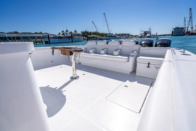 Slide: The Image of 2025 HCB 65 Estrella luxury boat deck with seating and ocean view. - 6