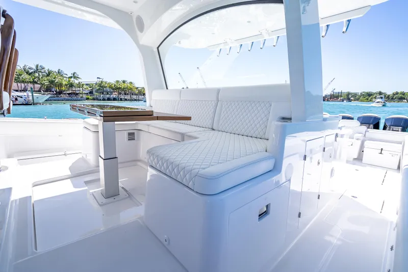 Slide: The Image of Luxurious interior of 2025 HCB 65 Estrella yacht with white seating and ocean view. - 8