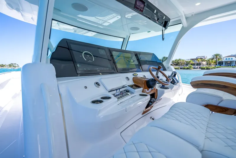 Slide: The Image of Luxurious 2025 HCB 65 Estrella yacht cockpit with advanced navigation system and plush seating. - 9