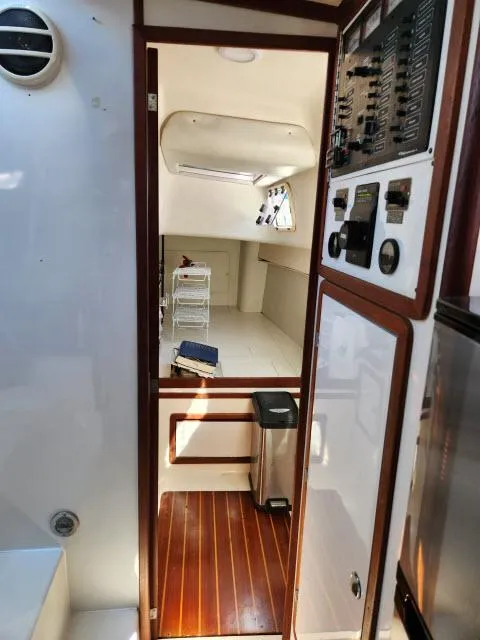 Slide: The Image of Interior of 1992 Endeavourcat 30 catamaran with wood flooring and control panel. - 10