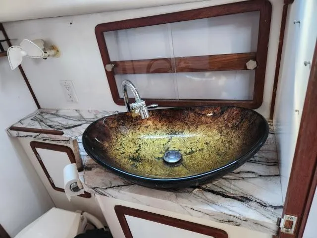 Slide: The Image of Luxurious bathroom sink in 1992 Endeavourcat 30 catamaran with marble countertop. - 17