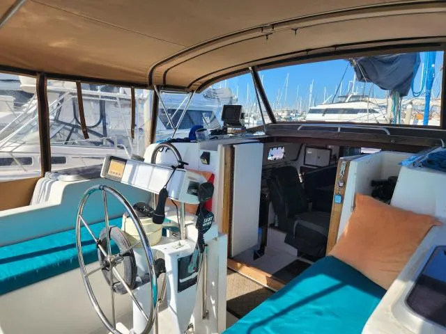 Slide: The Image of Interior view of 1992 Endeavourcat 30 catamaran with helm and seating area. - 20
