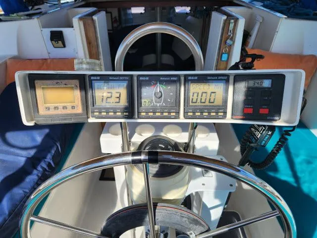 Slide: The Image of Cockpit of 1992 Endeavourcat 30 catamaran with navigation instruments and steering wheel. - 21