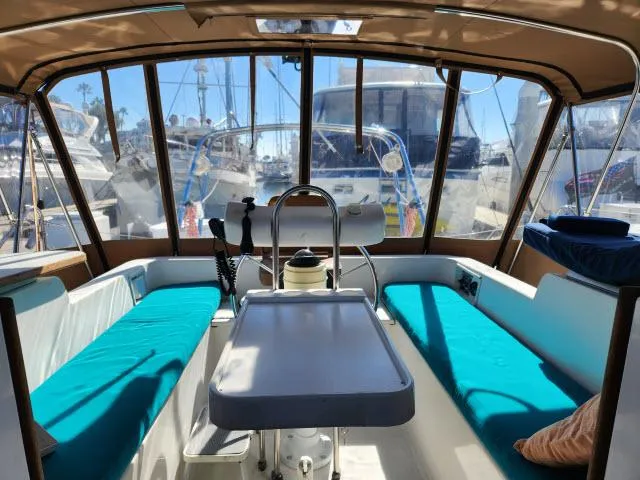 Slide: The Image of Interior view of 1992 Endeavour Catamaran Endeavourcat 30 with turquoise seating and table. - 24