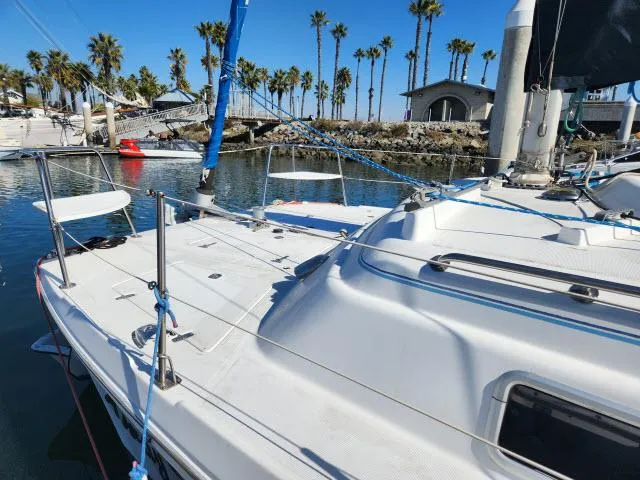 Slide: The Image of 1992 Endeavour Catamaran Endeavourcat 30 docked in sunny marina with palm trees. - 27