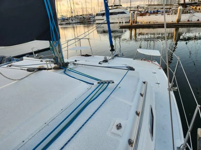 Slide: The Image of 1992 Endeavourcat 30 catamaran docked at marina during sunset. - 28