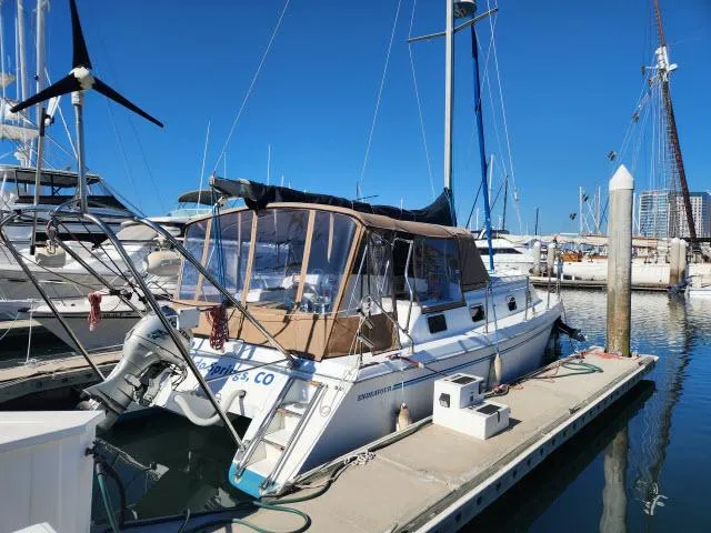 Slide: The Image of 1992 Endeavourcat 30 catamaran docked at marina under clear blue sky. - 35