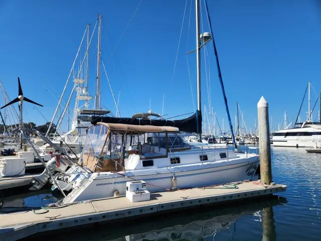 Slide: The Image of 1992 Endeavourcat 30 catamaran docked at marina under clear blue sky. - 36