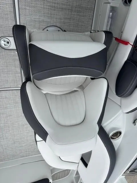 Slide: The Image of 2025 Crownline 280 SS boat seat with sleek black and white design. - 12