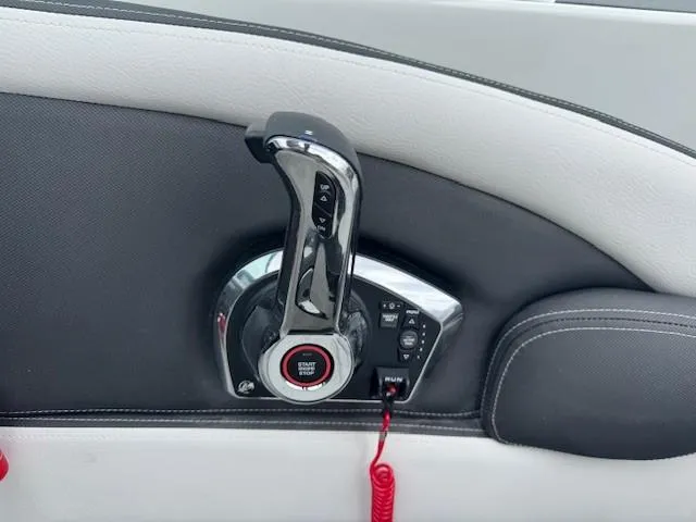 Slide: The Image of Throttle control of 2025 Crownline 280 SS boat, featuring sleek chrome and black design. - 13