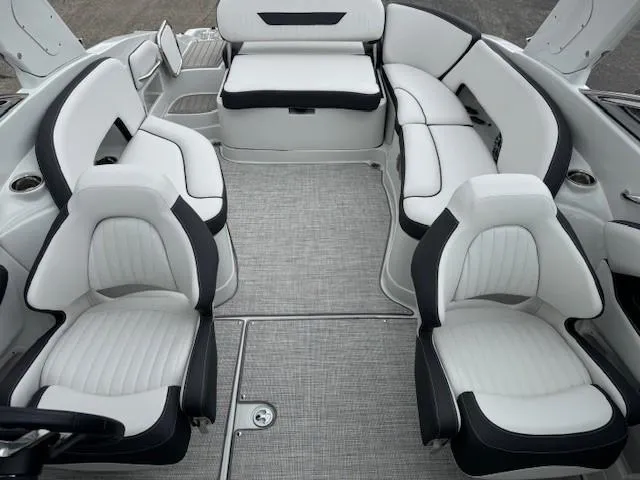 Slide: The Image of 2025 Crownline 280 SS boat interior with luxurious white seating and modern design. - 15
