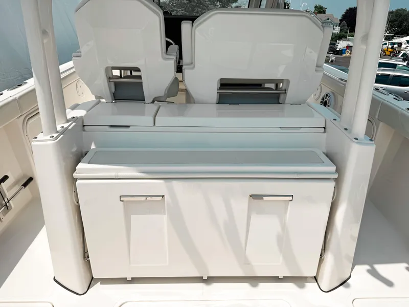Slide: The Image of 2022 Pursuit S 328 Sport boat interior with seating and storage compartments. - 13