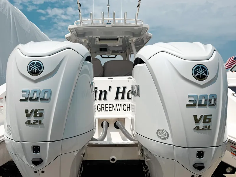 Slide: The Image of 2022 Pursuit S 328 Sport boat with twin Yamaha 300 V6 engines, rear view. - 2