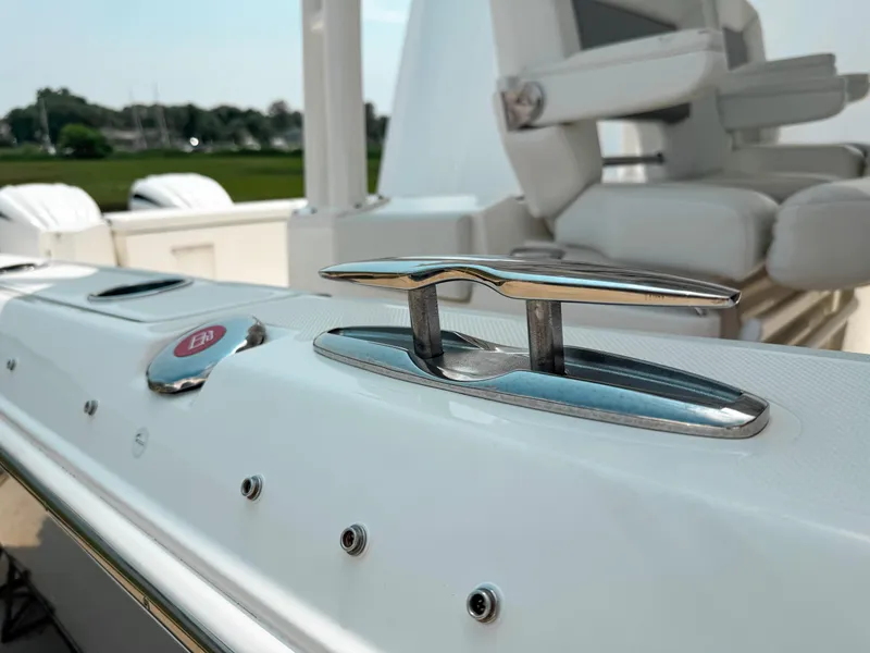 Slide: The Image of 2022 Pursuit S 328 Sport boat deck with cleat and seating in background. - 29