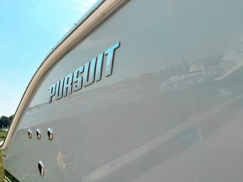 Slide: The Image of 2022 Pursuit S 328 Sport boat with sleek design and reflective surface. - 3