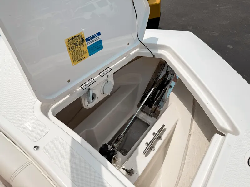 Slide: The Image of Open storage compartment on 2022 Pursuit S 328 Sport boat, showcasing interior details. - 35